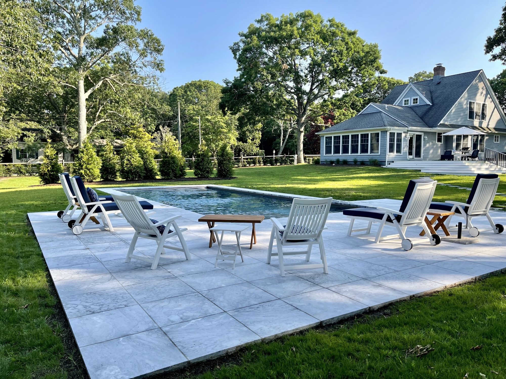 The private heated pool and stone deck, with the house behind